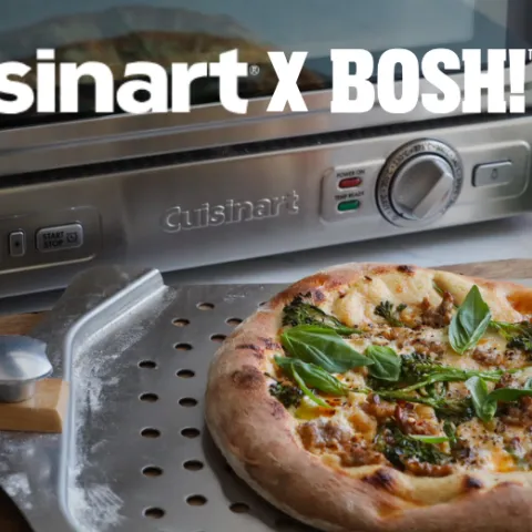 A pizza sitting in front of an oven with the text Cuisinart X BOSH! superimposed