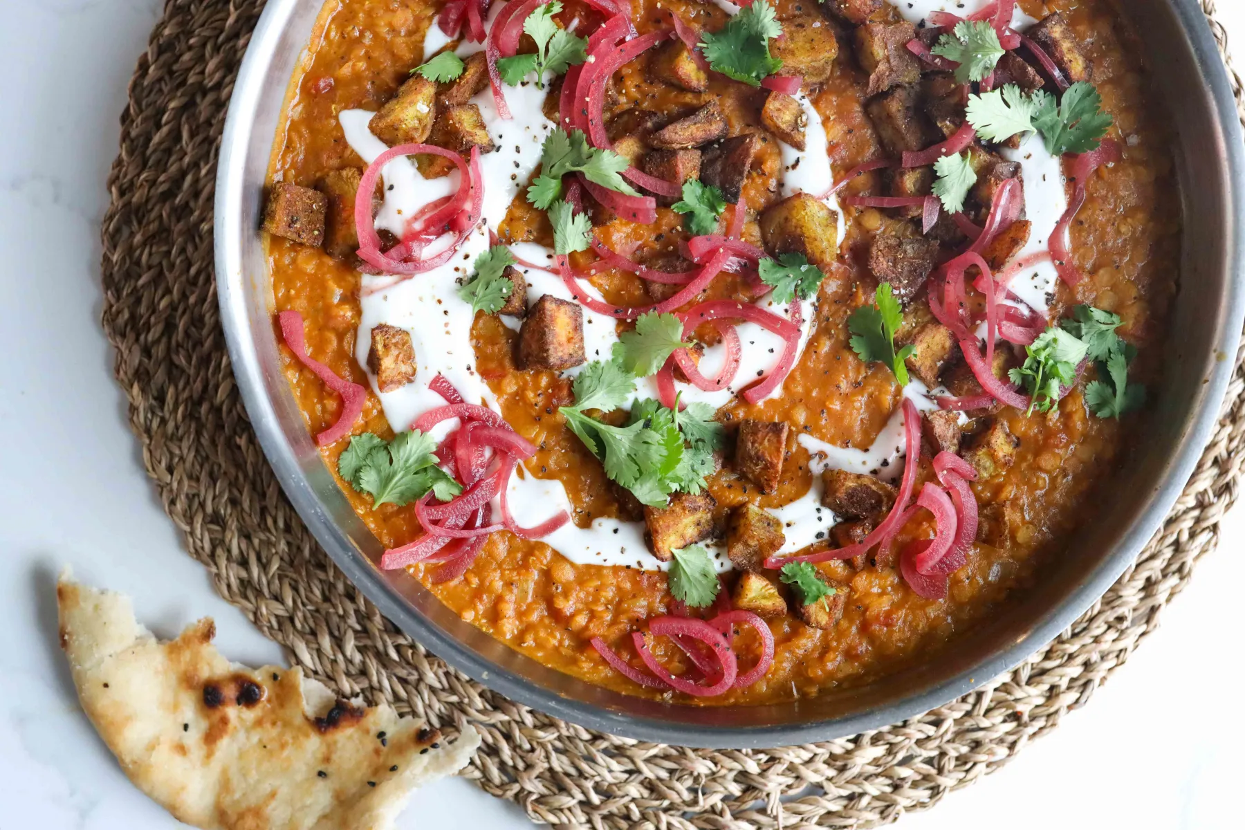 Creamy Dal Topped With Crispy Bombay Potatoes